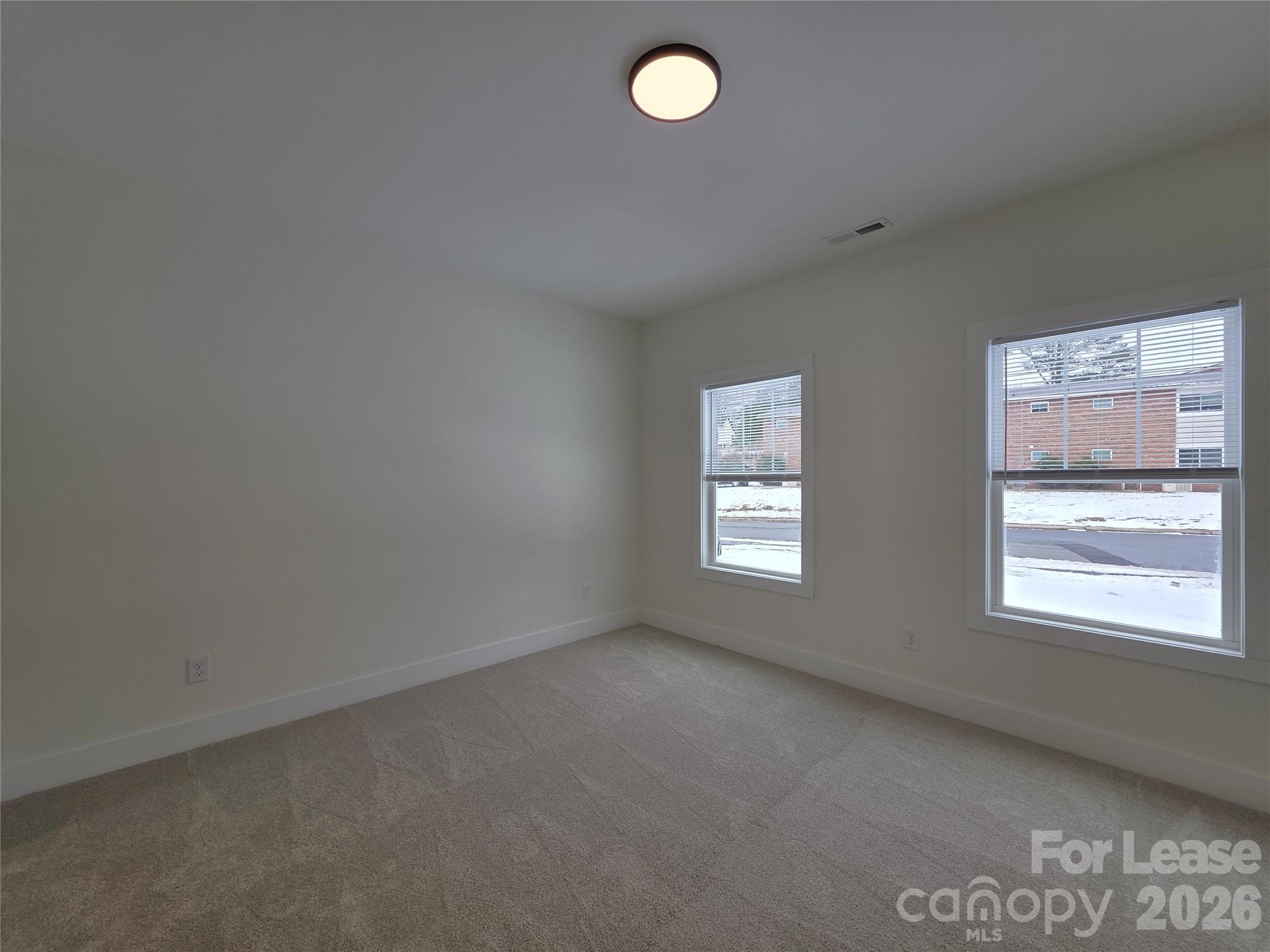 126 Heath Street Albemarle, NC 28001 - Photo 12 of 16 an empty room with a window