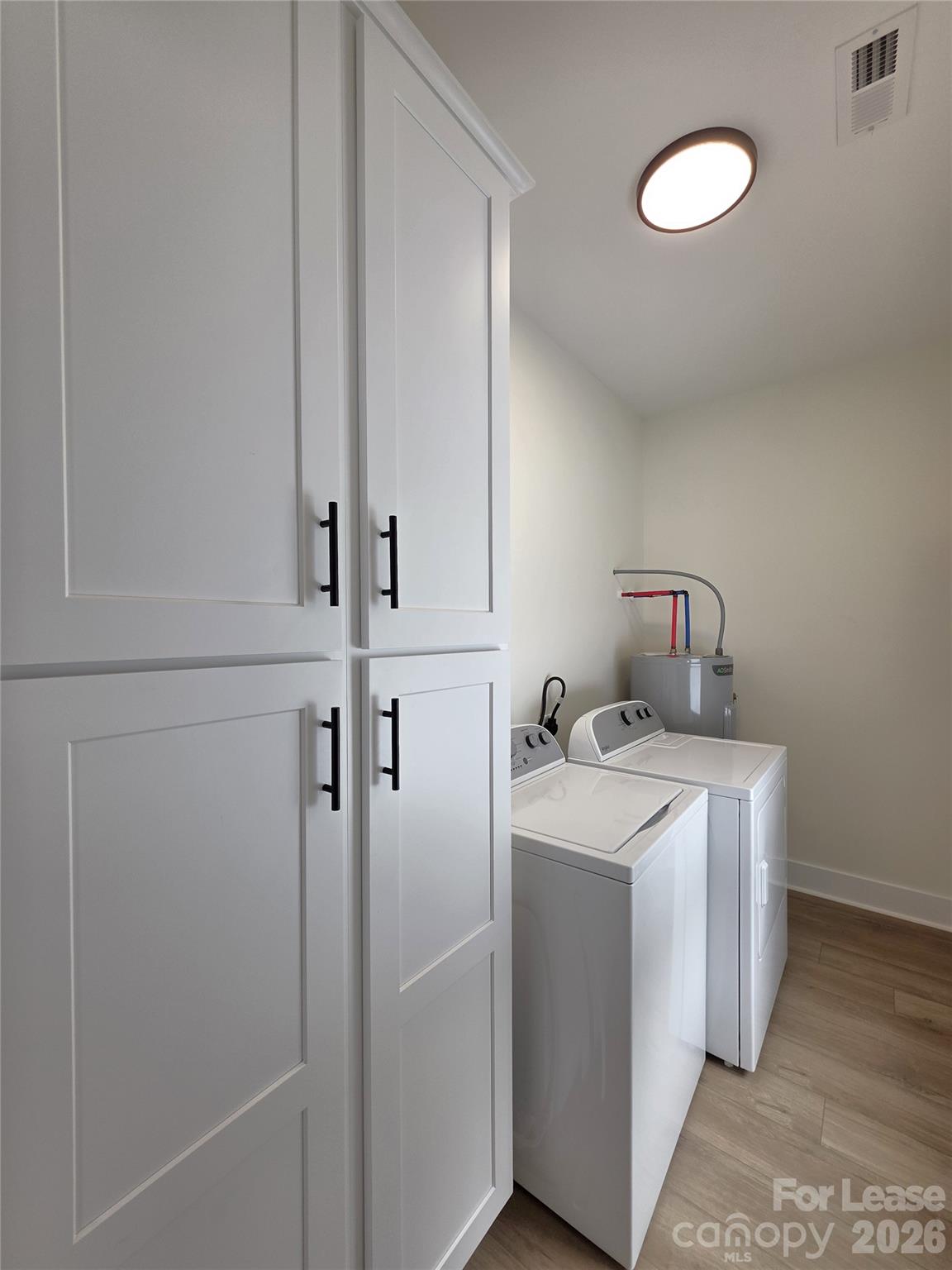 126 Heath Street Albemarle, NC 28001 - Photo 14 of 16 a utility room with dryer and washer