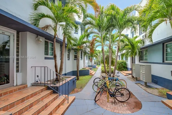 a view of a dinning table and chairs in patio