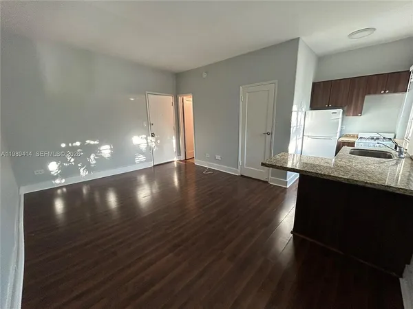 a view of a lobby room with wooden floor