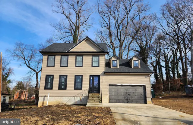 a front view of a house with yard