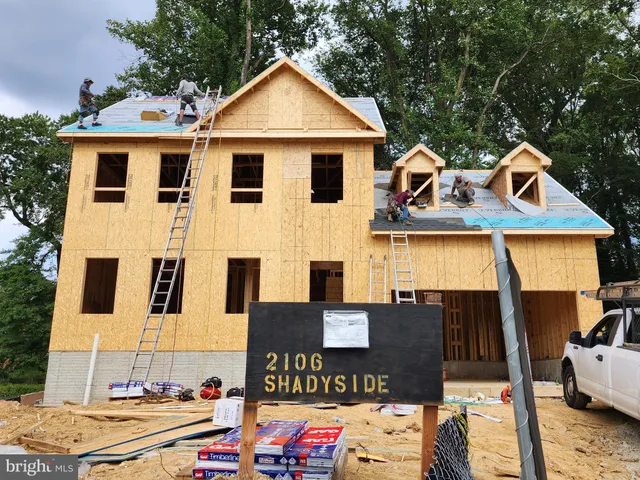 a front view of a house with parking