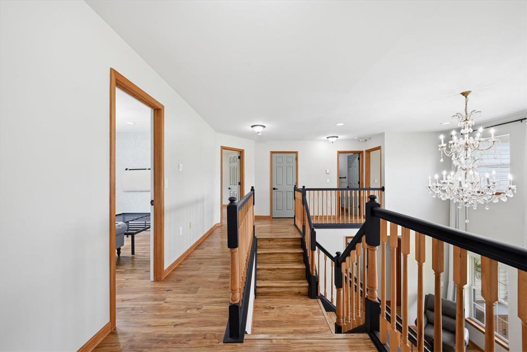 387 Blue Ridge Road Saylorsburg, PA 18353 - Photo 40 of 90 A grand, multi-level entryway with warm wood floors and elegant railing awaits.