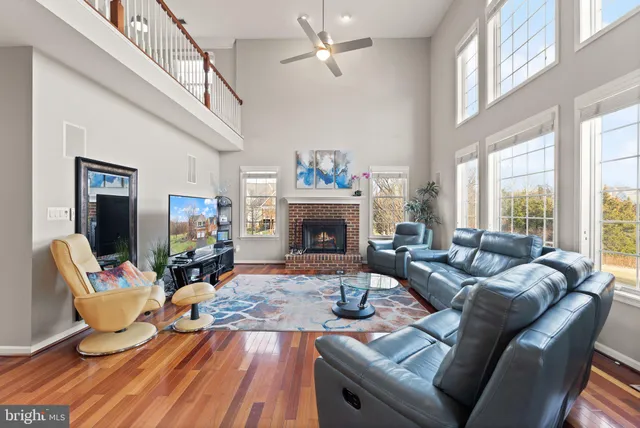 a view of a livingroom with furniture and stairs