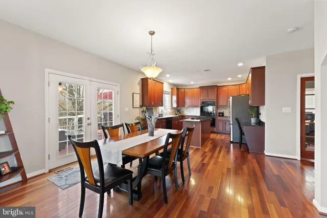 a bathroom with a granite countertop sink a shower and a mirror