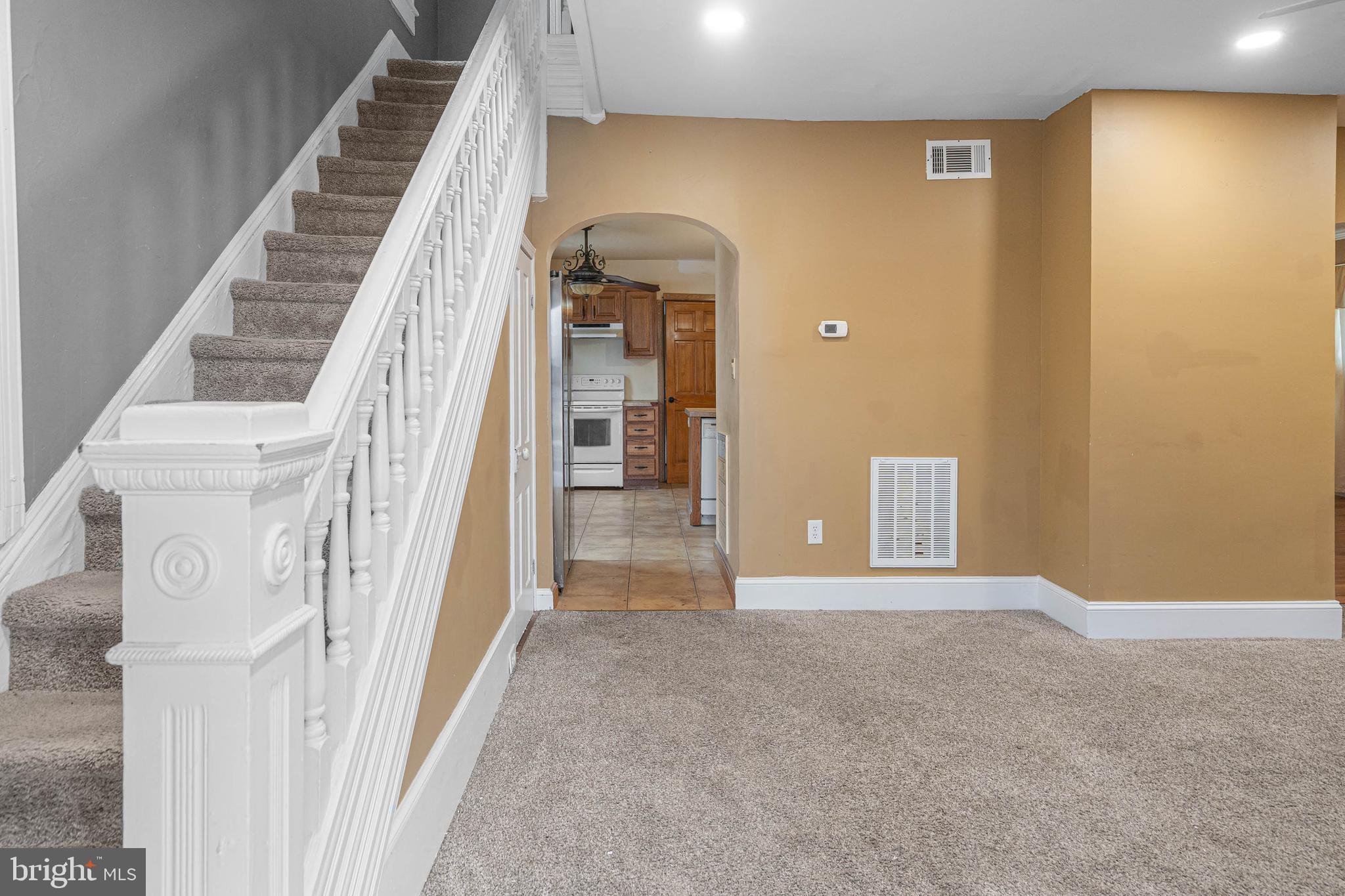 412 East State Street Delmar, MD 21875 - Photo 5 of 36 a view of a hallway with wooden floor and staircase