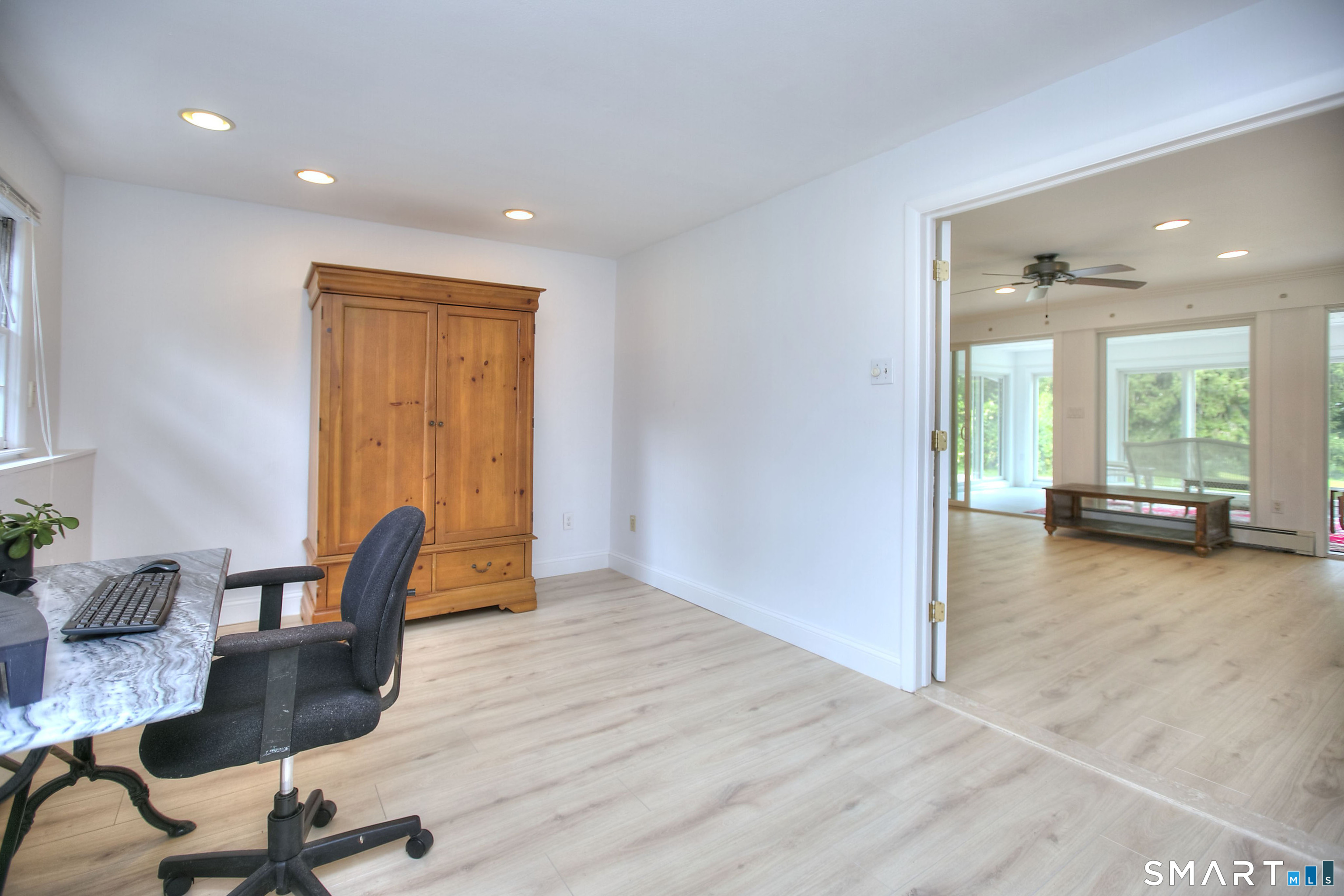 324 Ridge Road Orange, CT 06477 - Photo 21 of 38 a view of a workspace with furniture and a window