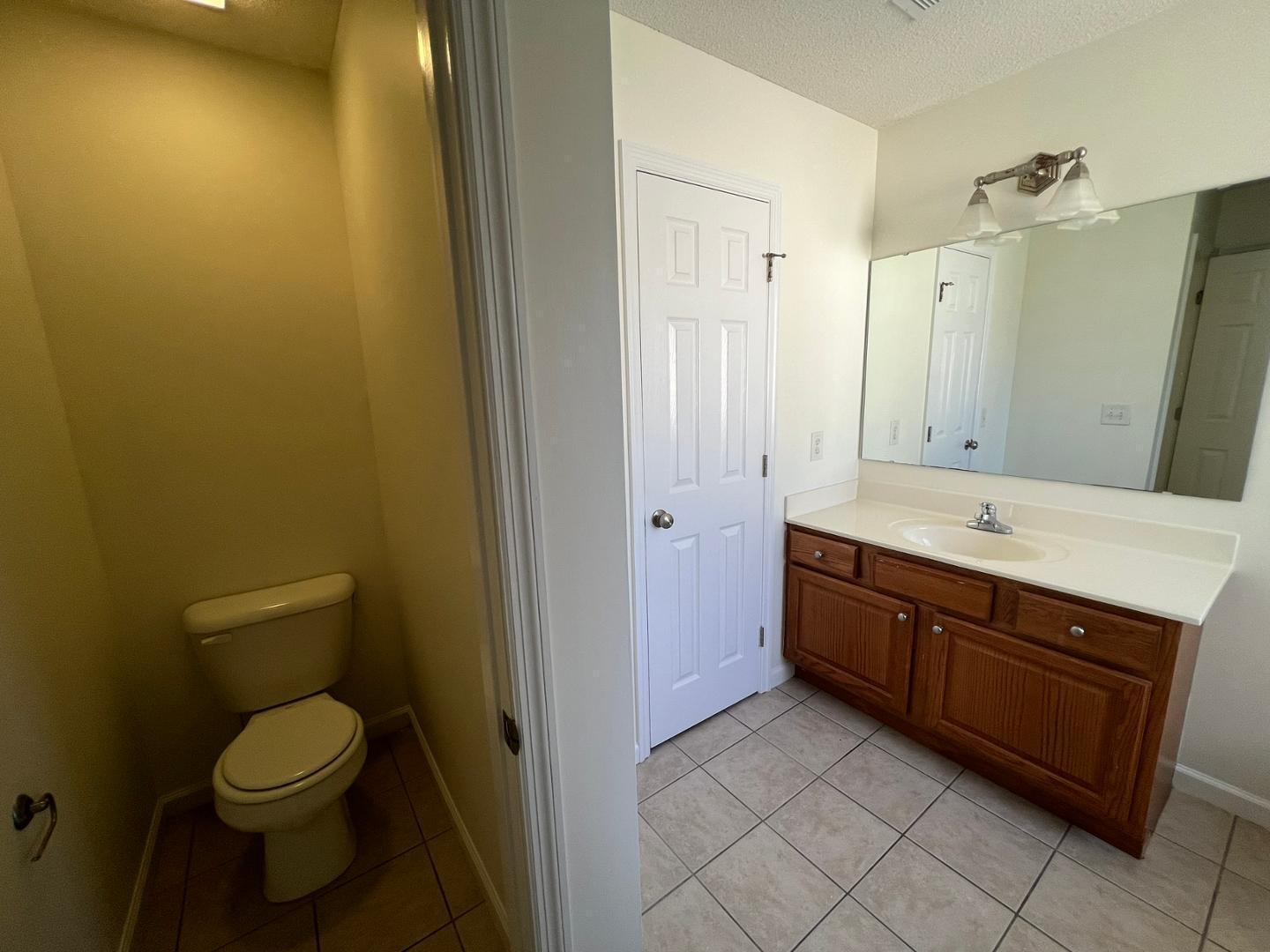 100 Dover Court East Sanford, NC 27332 - Photo 12 of 20 a bathroom with a granite countertop sink and a mirror