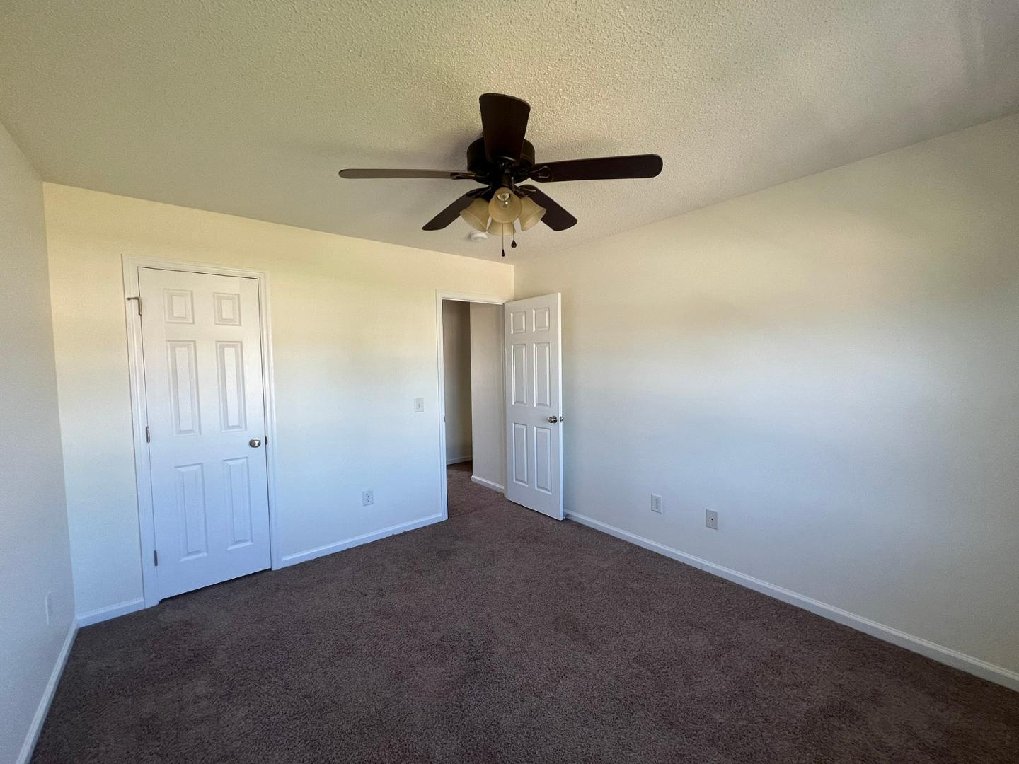 100 Dover Court East Sanford, NC 27332 - Photo 17 of 20 a view of a chandelier fan and hardwood floor