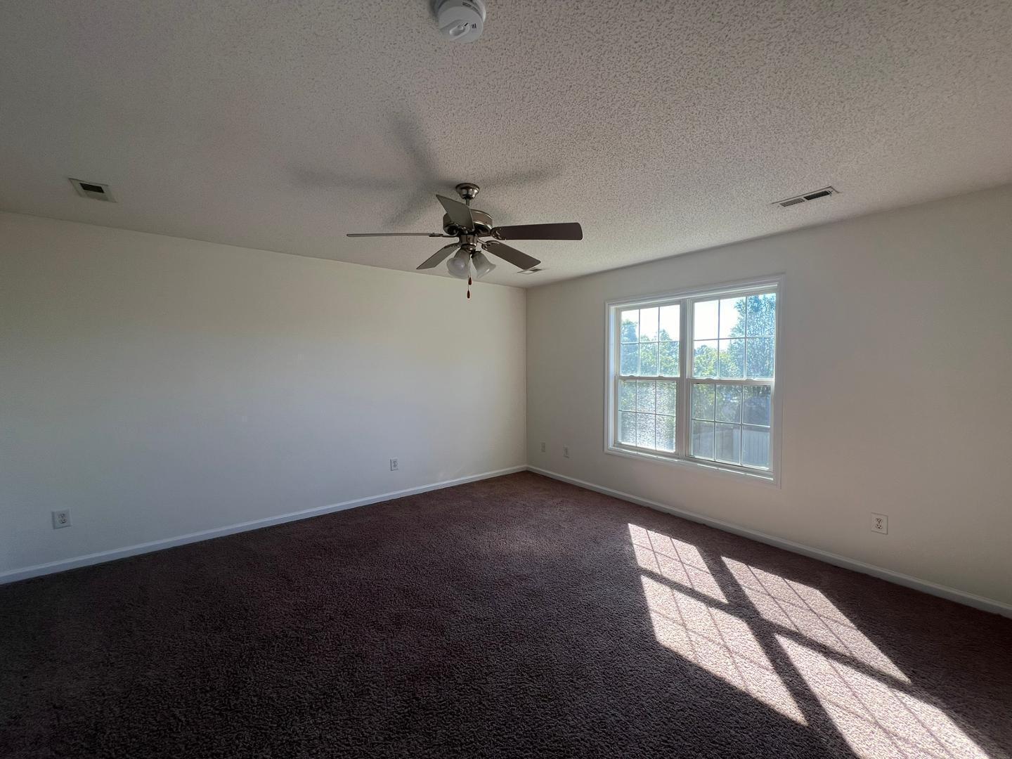 100 Dover Court East Sanford, NC 27332 - Photo 20 of 20 a view of an empty room with a window