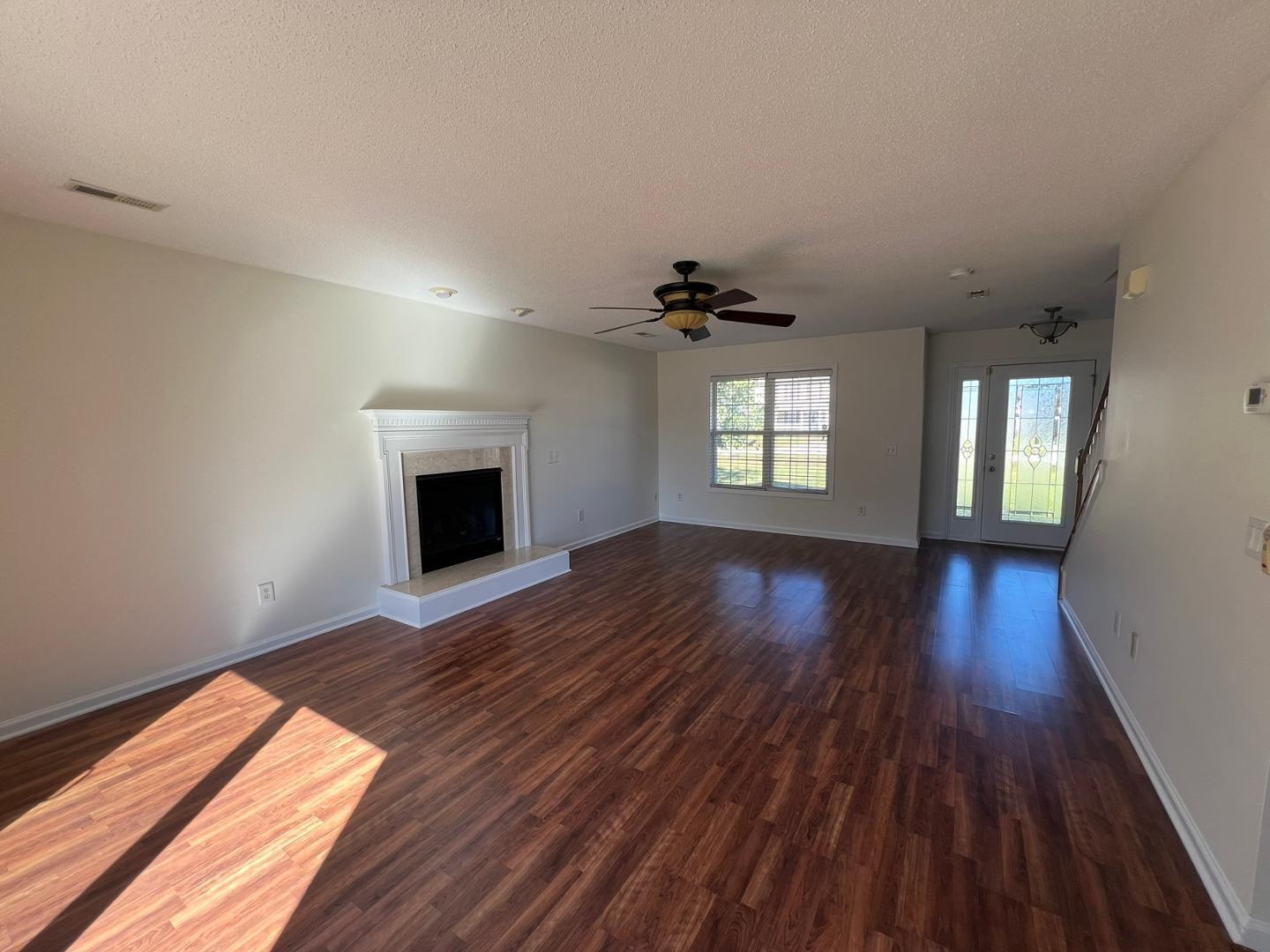100 Dover Court East Sanford, NC 27332 - Photo 3 of 20 wooden floor in an empty room with a window