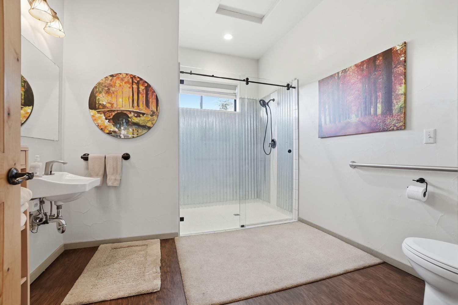 21645 Parrotts Ferry Road Sonora, CA 95370 - Photo 13 of 95 a bathroom with a sink a toilet and shower