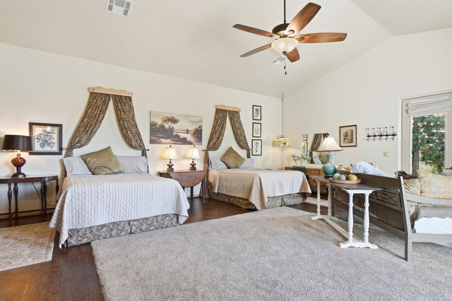 21645 Parrotts Ferry Road Sonora, CA 95370 - Photo 14 of 95 a bed room with two bed and a chandelier