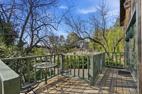 a bathroom with a glass door shower and a sink
