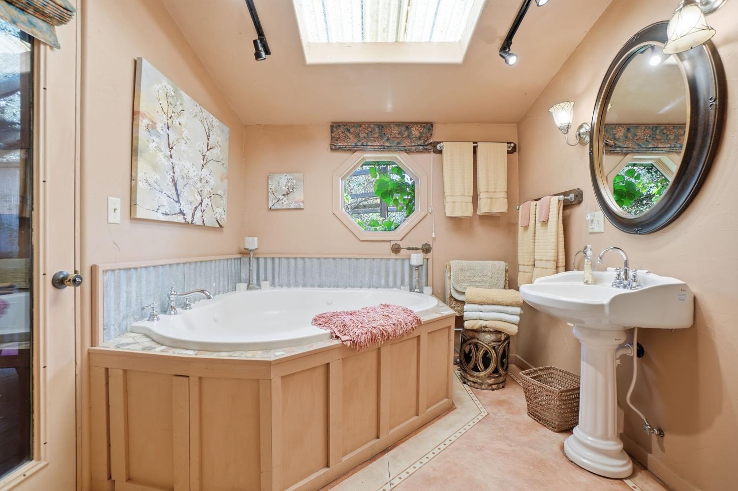 21645 Parrotts Ferry Road Sonora, CA 95370 - Photo 19 of 95 a bathroom with a sink and a mirror