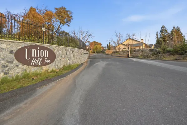 a view of a road with a building in the background