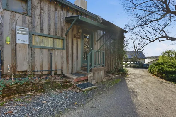 a view of a large building with a small yard
