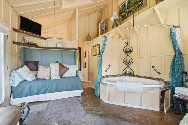 a view of a chairs and table in backyard of the house