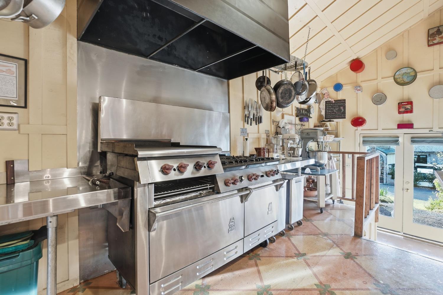 21645 Parrotts Ferry Road Sonora, CA 95370 - Photo 29 of 95 a kitchen with stainless steel appliances granite countertop a sink and a stove