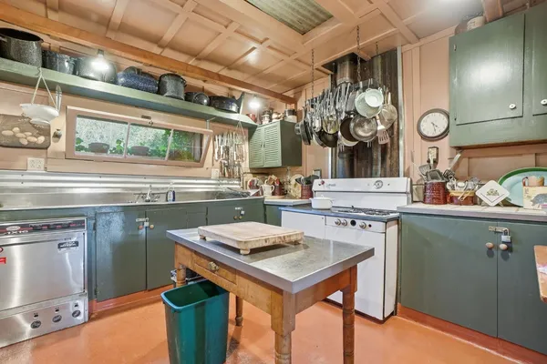 a view of a backyard with sitting area