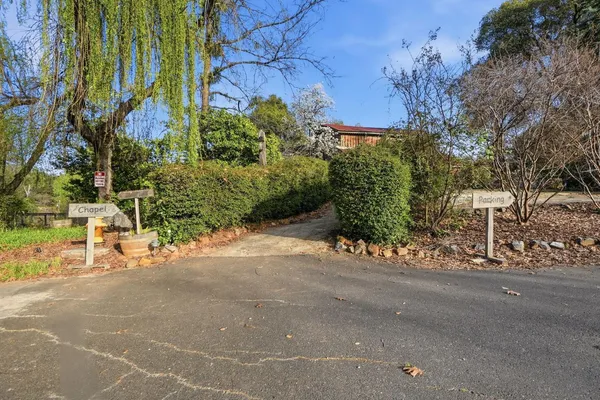 a view of a patio with a table and chairs