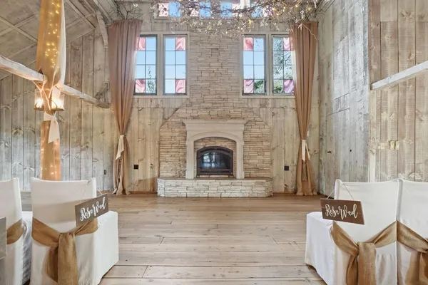a living room with lots of furniture and a view of kitchen