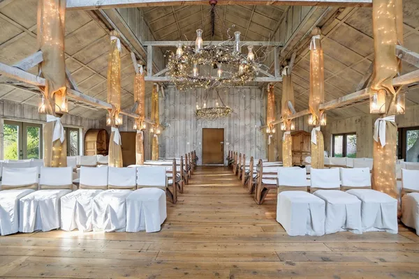 a view of an empty room with fireplace and a window