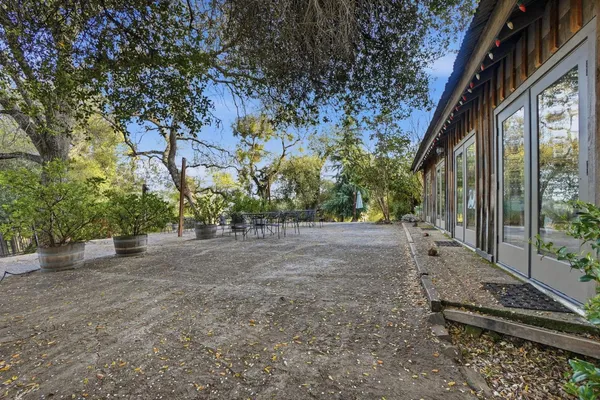 a large kitchen with stainless steel appliances granite countertop a lot of counter space and a sink