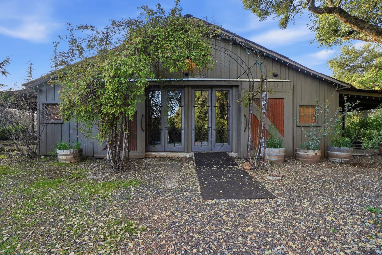 21645 Parrotts Ferry Road Sonora, CA 95370 - Photo 55 of 95 a view of a house with a small yard and a large tree