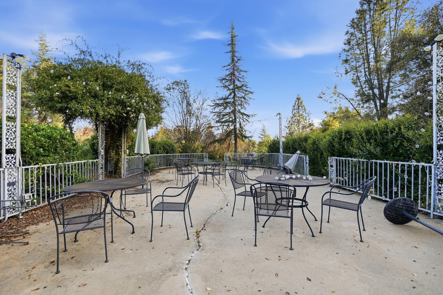 21645 Parrotts Ferry Road Sonora, CA 95370 - Photo 62 of 95 a view of a patio with a table and chairs