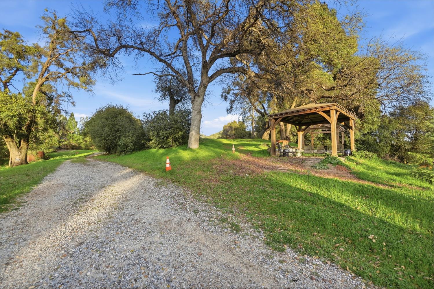 21645 Parrotts Ferry Road Sonora, CA 95370 - Photo 63 of 95 a front view of a house with garden