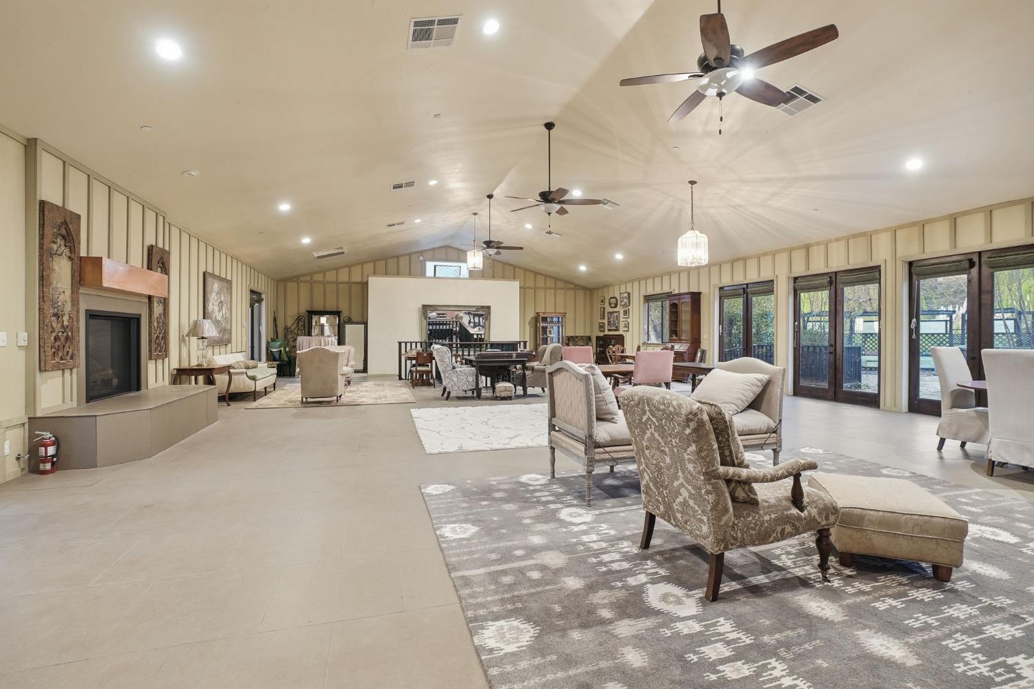 21645 Parrotts Ferry Road Sonora, CA 95370 - Photo 72 of 95 a living room with furniture and a chandelier