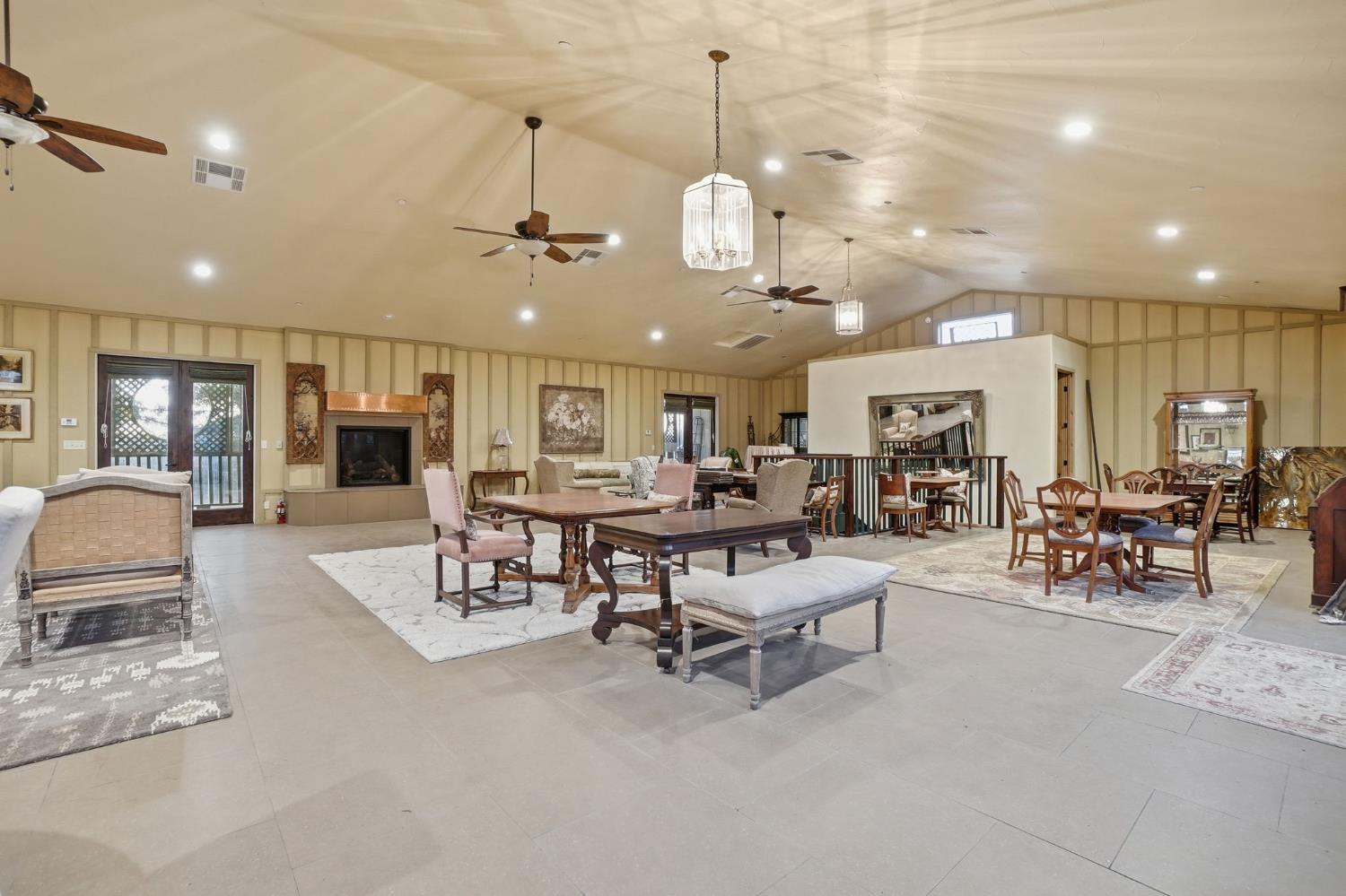 21645 Parrotts Ferry Road Sonora, CA 95370 - Photo 74 of 95 a living room with lots of furniture and a view of kitchen