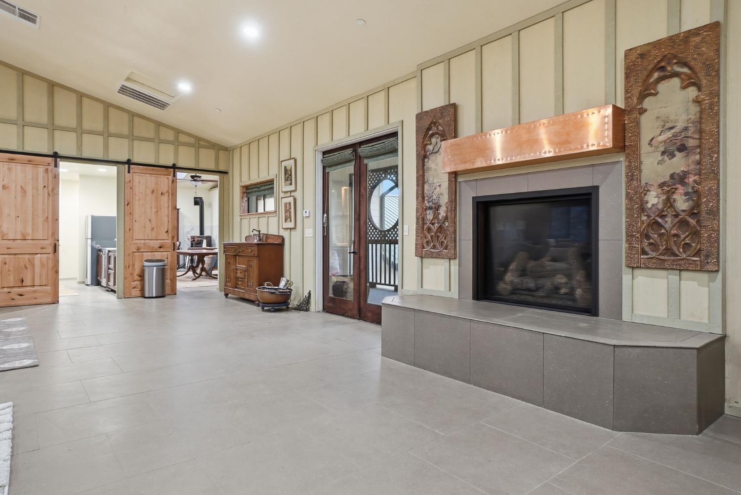 21645 Parrotts Ferry Road Sonora, CA 95370 - Photo 75 of 95 a view of an empty room with fireplace and a window