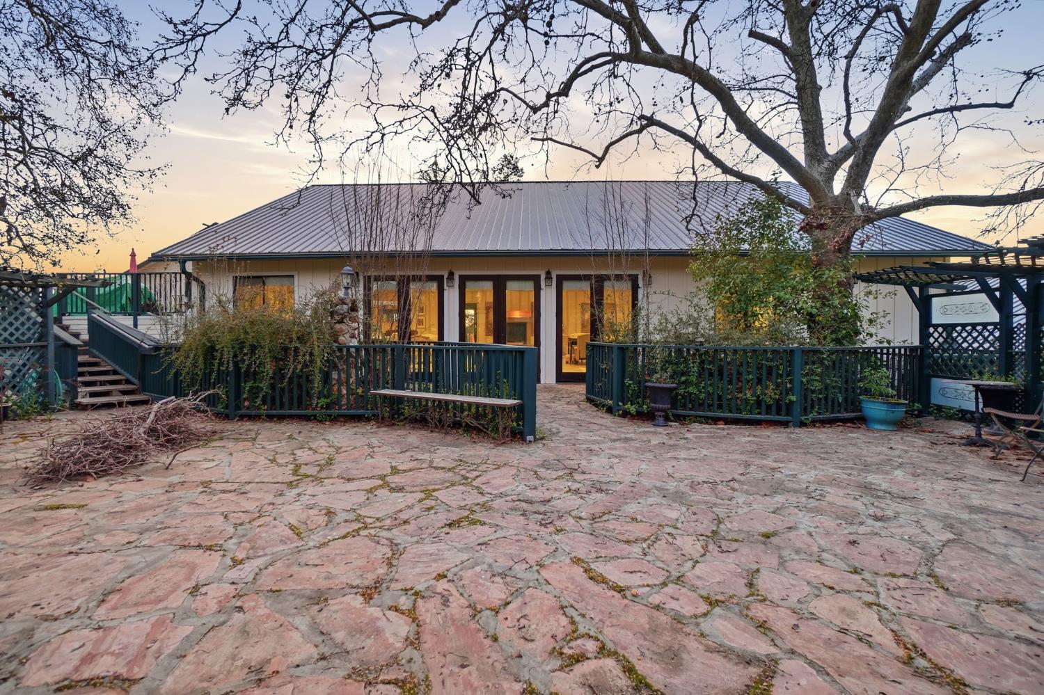 21645 Parrotts Ferry Road Sonora, CA 95370 - Photo 79 of 95 a backyard of a house with yard and outdoor seating