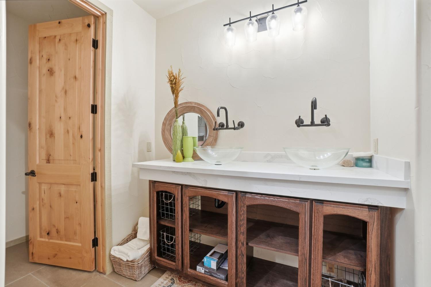 21645 Parrotts Ferry Road Sonora, CA 95370 - Photo 81 of 95 a bathroom with a sink and a mirror