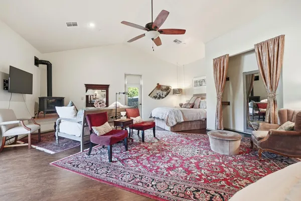 a bed room with two bed and a chandelier