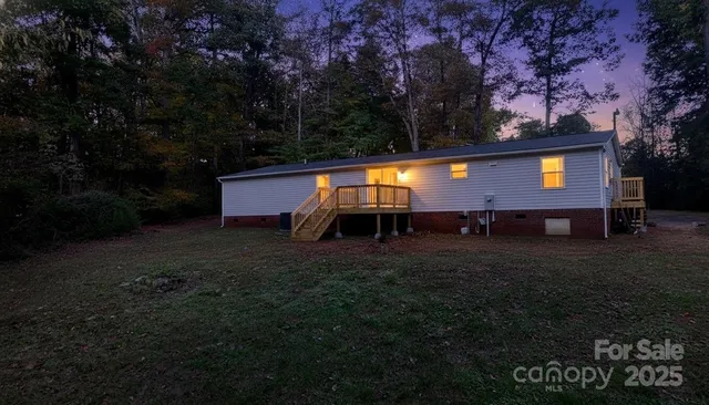a view of a backyard with a garden and entertaining space
