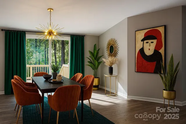 a dining room with furniture potted plants and wooden floor