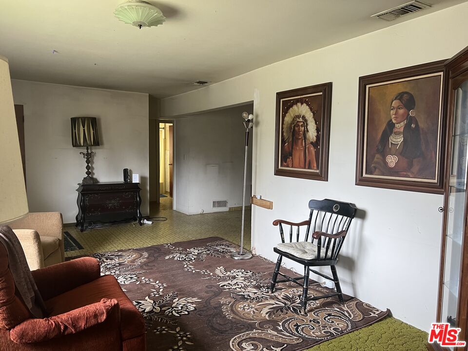 9934 Tujunga Canyon Boulevard Tujunga, CA 91042 - Photo 3 of 15 a living room with furniture and a rug