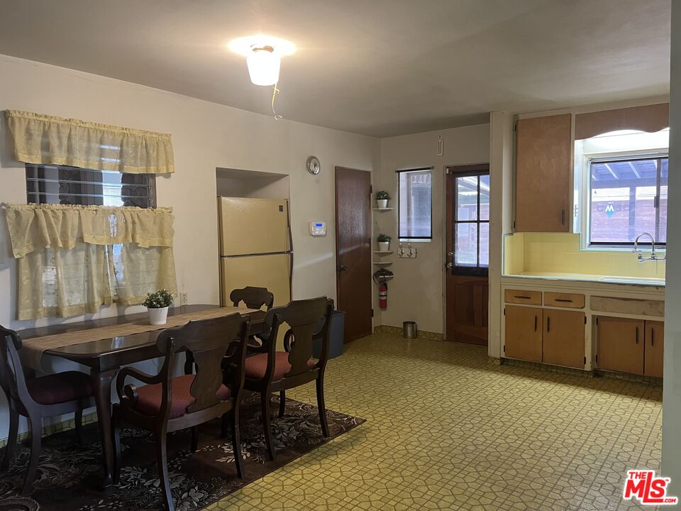 9934 Tujunga Canyon Boulevard Tujunga, CA 91042 - Photo 7 of 15 a view of a dining room with furniture