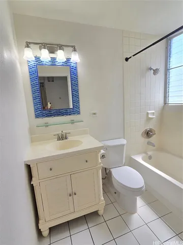 a bathroom with a sink toilet vanity and shower