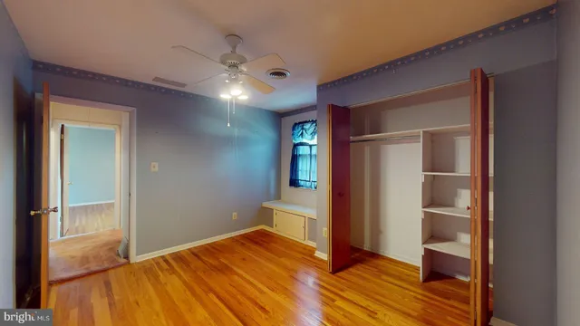 a bedroom with a bed and a view of en suite bathroom