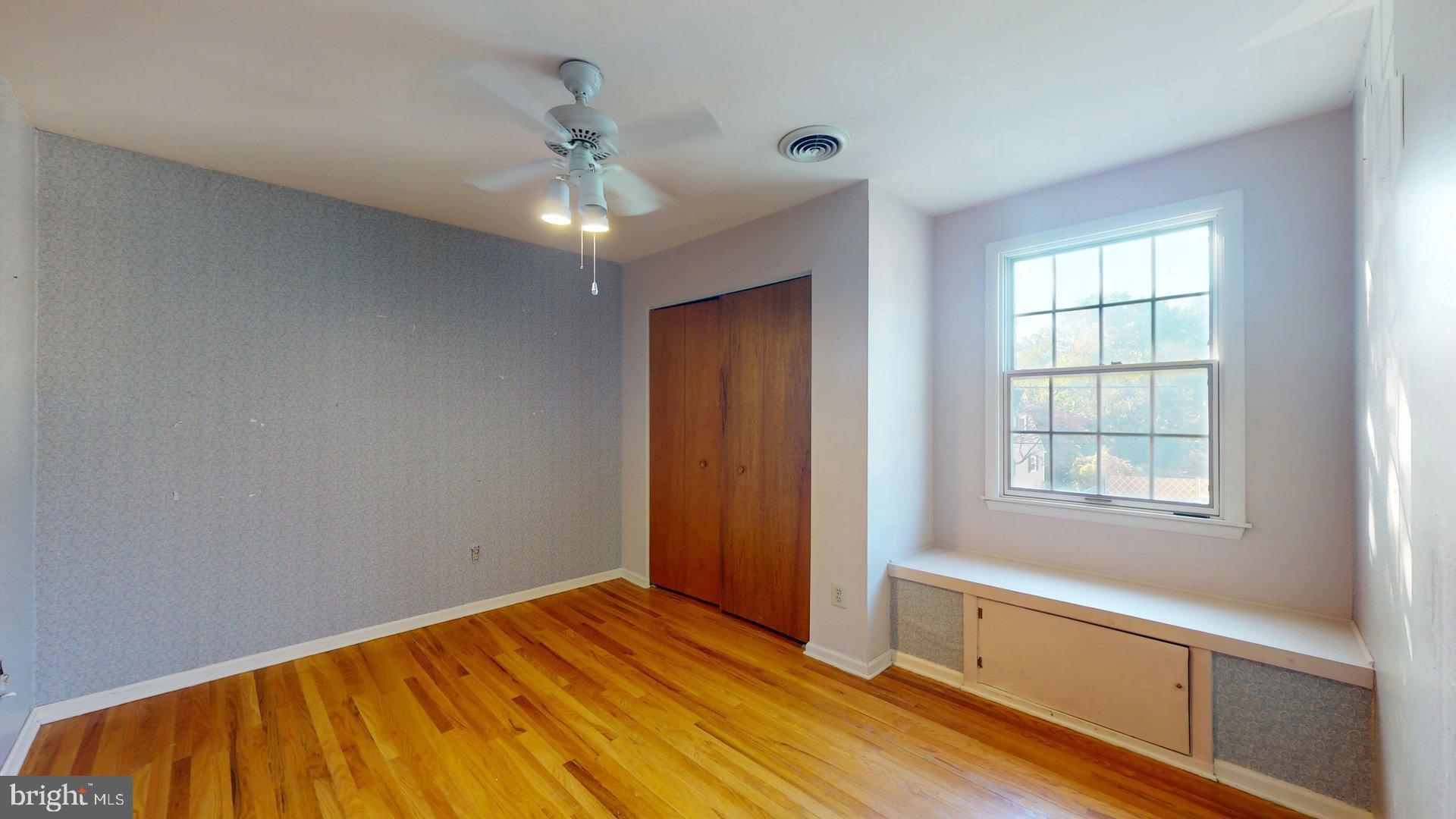 217 3rd Avenue Glendora, NJ 08029 - Photo 7 of 17 a view of an empty room with a window