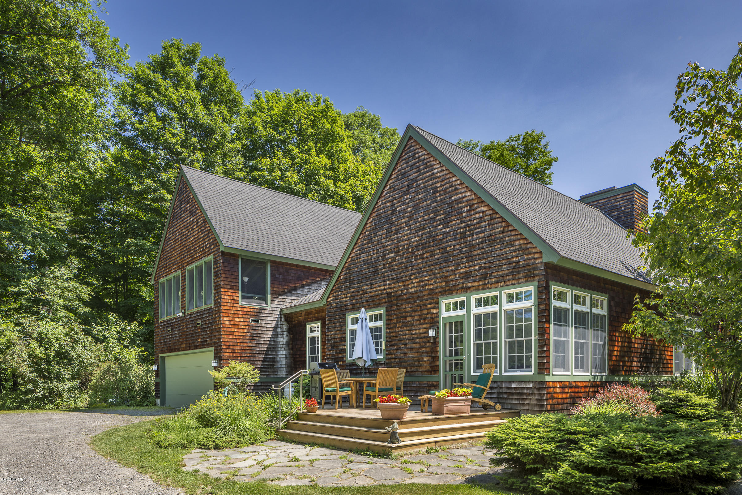 1 Mahkeenac Road Stockbridge, MA 01262 - Photo 1 of 32 a front view of a house with a yard