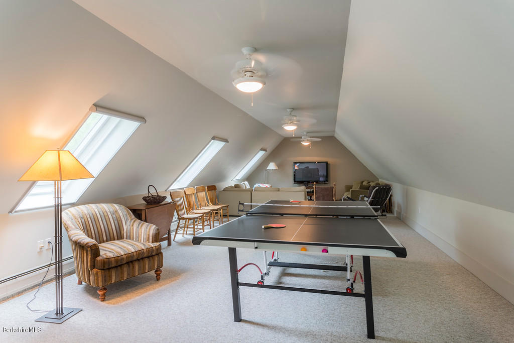 1 Mahkeenac Road Stockbridge, MA 01262 - Photo 14 of 32 a room with furniture and a chandelier