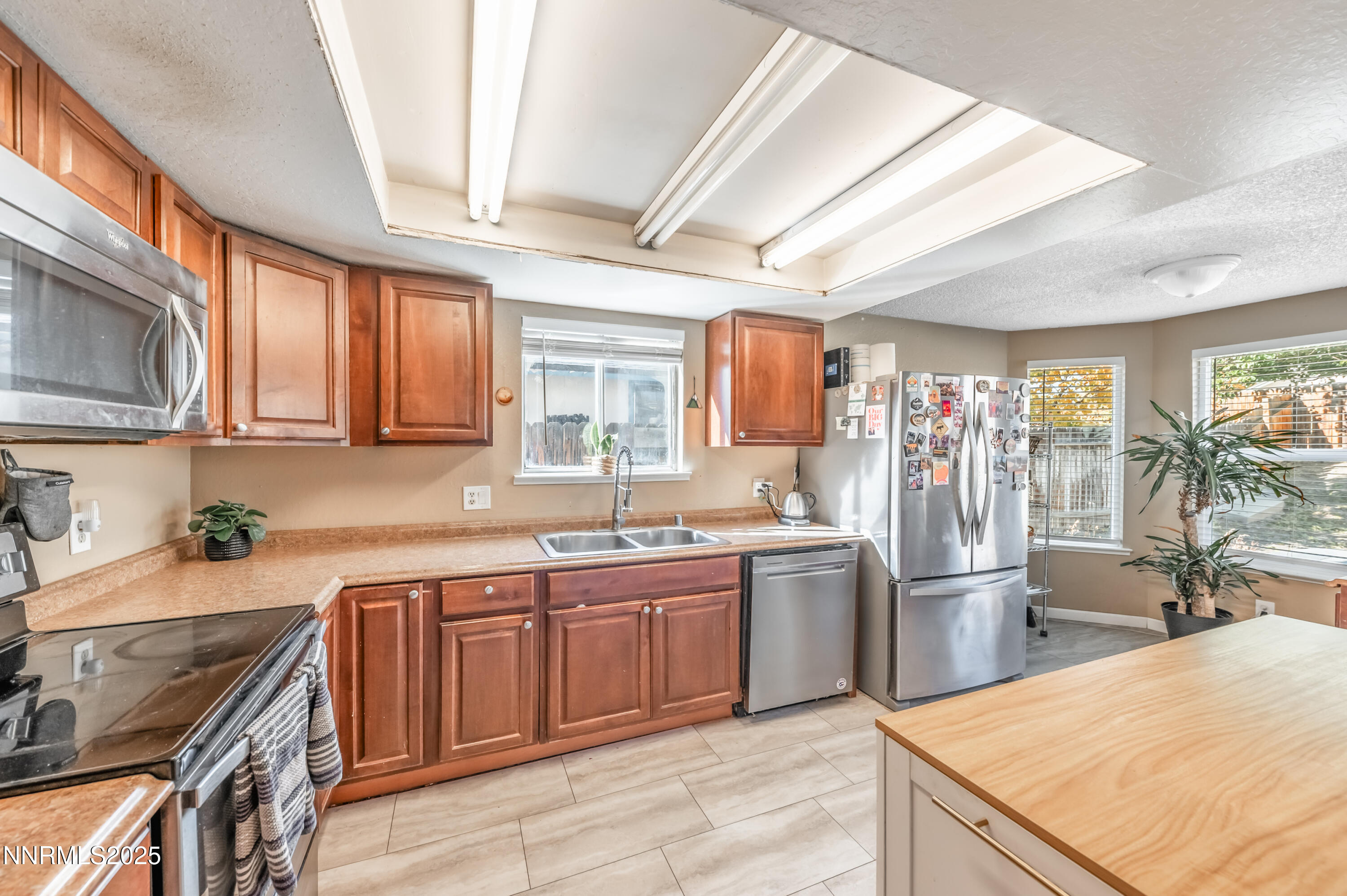 1185 Westlake Road Reno, NV 89523 - Photo 13 of 26 a kitchen with stainless steel appliances granite countertop a sink stove and refrigerator