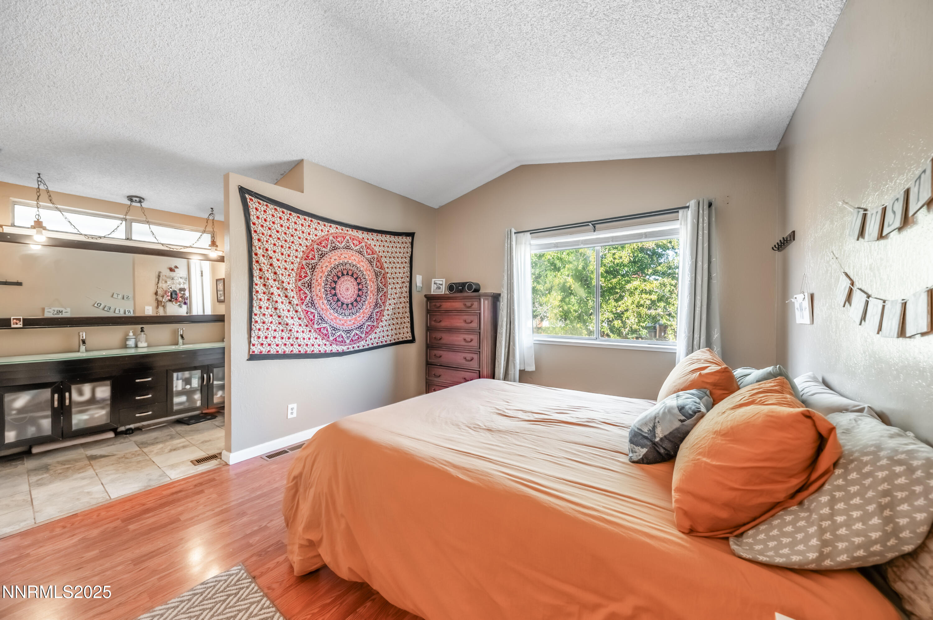 1185 Westlake Road Reno, NV 89523 - Photo 17 of 26 a bedroom with a bed and glass windows