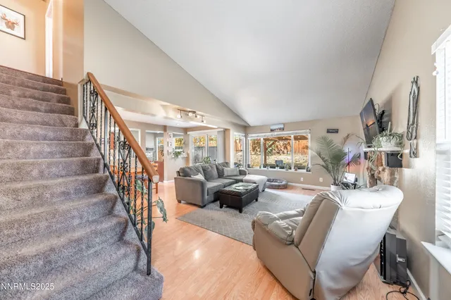 a living room with furniture or stairs and a view of living room