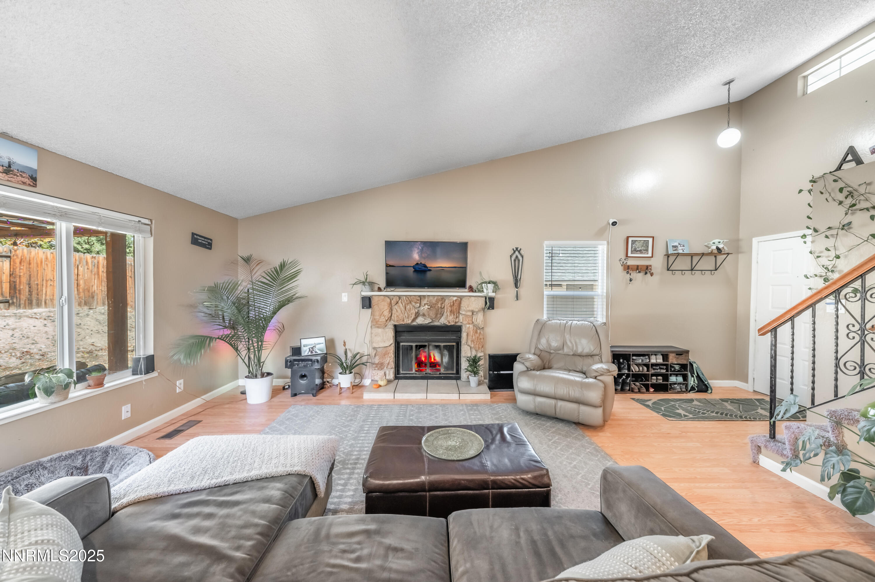 1185 Westlake Road Reno, NV 89523 - Photo 6 of 26 a living room with furniture large window and a fireplace